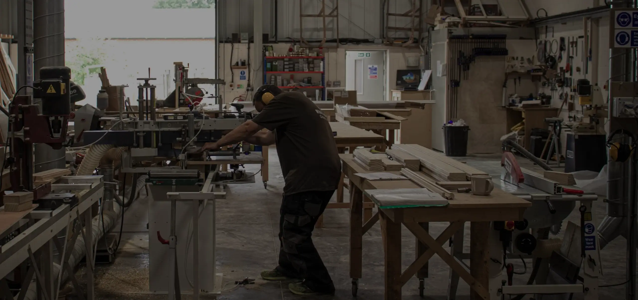 Craftsman making a greenhouse in the White Cottage workshop